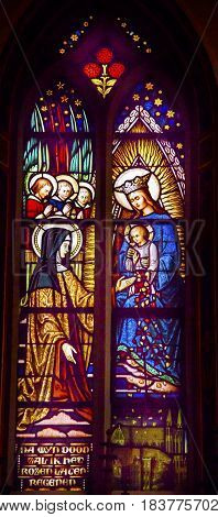 AMSTERDAM, NETHERLANDS - MARCH 30, 2017 Quenn Mary Baby Jesus Nun Stained Glass Window De Krijtberg Church Amsterdam Holland Netherlands.
