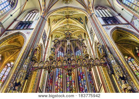 AMSTERDAM, NETHERLANDS - MARCH 30, 2017 Basilica Christ Crucifix Stained Glass De Krijtberg Church Amsterdam Holland Netherlands. Roman Catholic Church built in 1883 maybe the most beautiful church in Amsterdam.