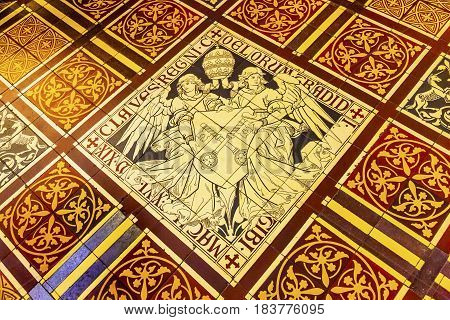AMSTERDAM, NETHERLANDS - MARCH 30, 2017 Papal Keys Angels Tile Floor De Krijtberg Church Amsterdam Holland Netherlands. De Krijtberg may be the most beautiful church in Amsterdam.