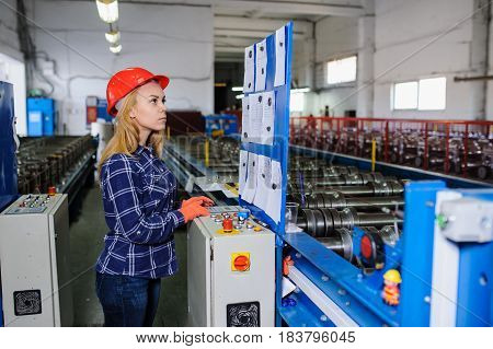Woman In Red Safety Helmet Work As Industrial Worker