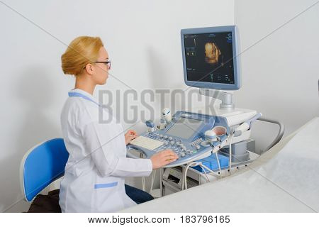 Doctor Analyze The Result Of Ultrasound Diagnostic Machine