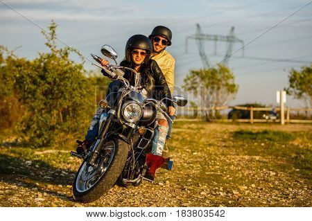 Beautiful Young Couple With A Classic Motorcycle
