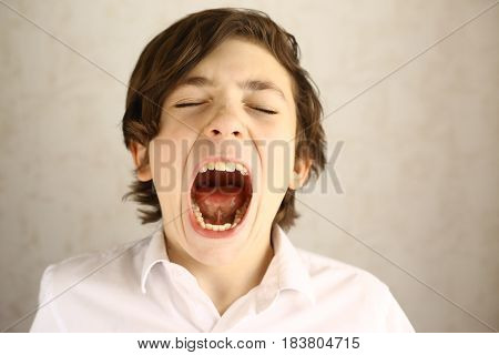 Teenager Boy Yawning Open Mouth