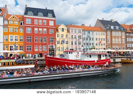 COPENHAGEN DENMARK - JULY 31 2016: Summer view of the famous Nyhavn with its colorful buildings