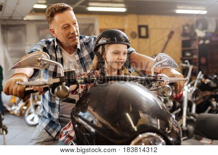 Lets imagine a road. Creative charismatic loving dad entertaining his child while giving her a tour at his workplace and having fun together