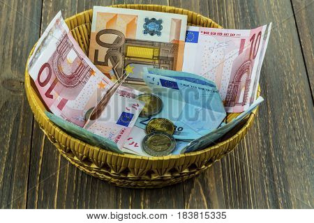 basket with money from donations