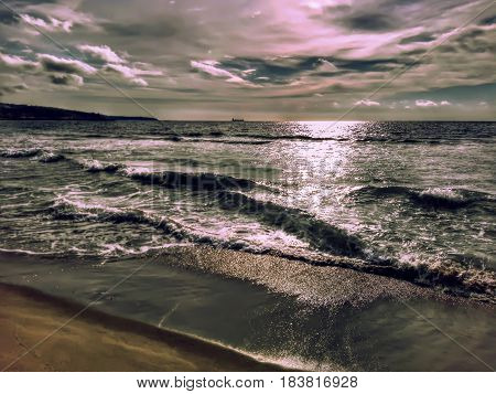 A picture of the beach at sunrise.
