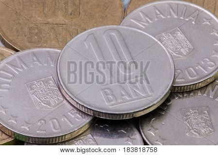 Detail of different Romania Leu coins on the table.
