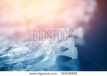 Dropper in a vein close-up. Blue background. The concept of body cleansing. high contrast and monochrome color tone.