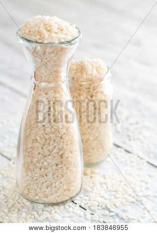 Arborio rice in the glass bottle close up