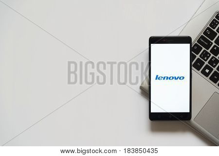 Bratislava, Slovakia, April 28, 2017: Lenovo logo on smartphone screen placed on laptop keyboard. Empty place to write information.