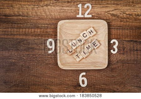Lunch time wooden alphabet with number of clock. Lunch time concept.
