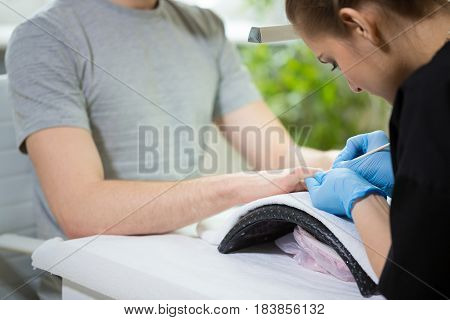 Close-up of man's hands at beautician's during manicure