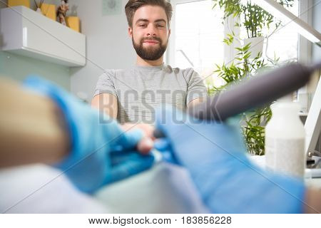 Close-up of man's hands at beautician's during manicure