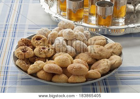Traditional variety of festive Moroccan cookies and mint tea