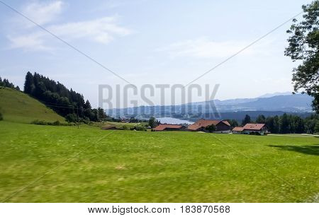Deutschland: Allgau panorama. mountains and green meadows