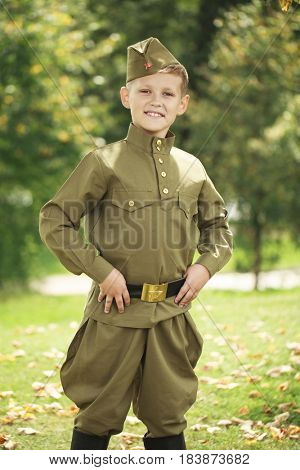 Russian boy in military uniform of the Soviet Army of the Second World War
