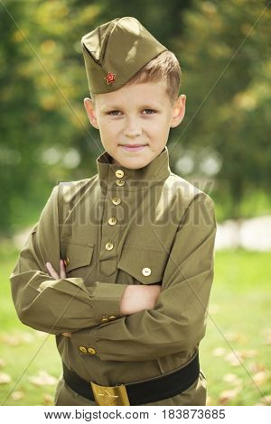 Russian boy in military uniform of the Soviet Army of the Second World War