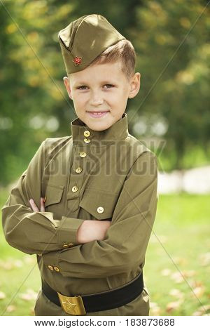 Russian boy in military uniform of the Soviet Army of the Second World War