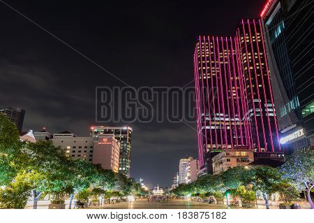 HO CHI MINH CITY VIETNAM - March 27 2917 : Ho Chi Minh City Hall on Nguyen Hue. Night view from Nguyen Hue. The Reverie Saigon building on right side.