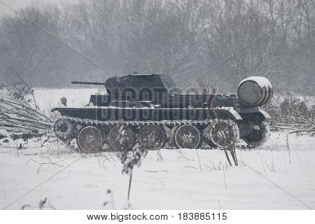 LENINGRAD REGION, RUSSIA - JANUARY 15, 2017: German tank PzKpfw II Ausf D in the snowy forest before the attack on the position of the Soviet Army. Military-historical reconstruction of battles of the Second world war