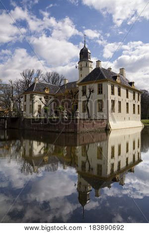 The stately castle Fraeylemaborg seen from the surrounding park near Slochteren in the Dutch province Groningen