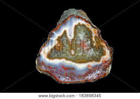 A cross section of the agate stone with quartz geode. Multicolored silica rings colored with metal oxides are visible. Origin: Asni Atlas Mountains Morocco.