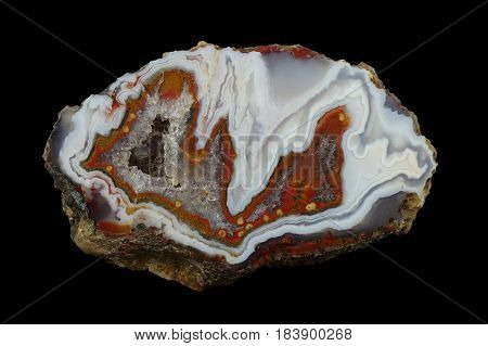 A cross section of the stalactite agate stone with quartz geode. Multicolored silica rings colored with metal oxides are visible. Origin: Asni Atlas Mountains Morocco.