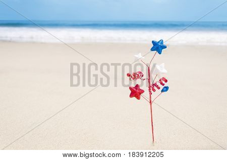Independence Day USA background with decoration on the sandy beach near the ocean/ American Patriotic comcept