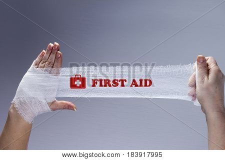 White medical dressing on a traumatized female hand