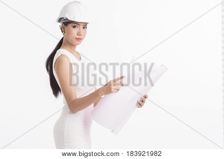 Sexy girl structural engineer holding drafting paper white background photo