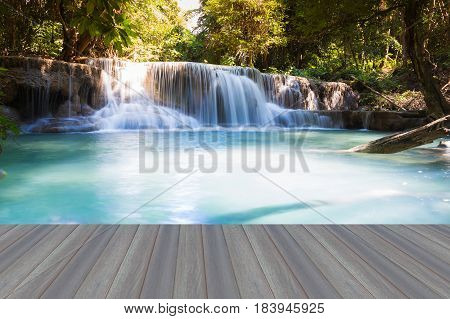 Opening wooden floor Blue stream natural deep forest waterfall nautral landscape background