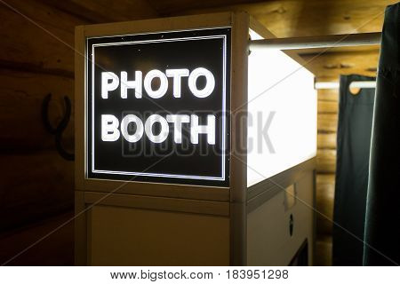 Sign at a wedding reception says photo booth.
