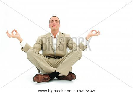 Businessman sitting in lotus position to get rid of office stress, isolated on white background