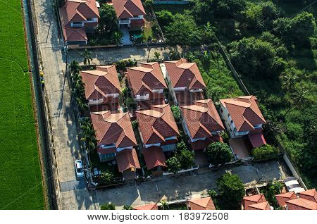 Red roofs in residential area housing view from the air