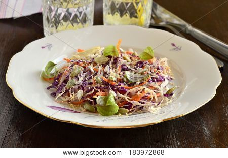 Salad with cabbage carrots and pumpkin sunflower sesame seeds. Cole Slaw