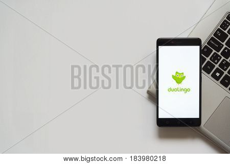 Bratislava, Slovakia, April 28, 2017: Duolingo logo on smartphone screen placed on laptop keyboard. Empty place to write information.