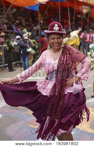 ORURO, BOLIVIA - FEBRUARY 26, 2017: Morenada dance group in colourful outfits parading through the mining city of Oruro on the Altiplano of Bolivia during the annual Oruro Carnival.