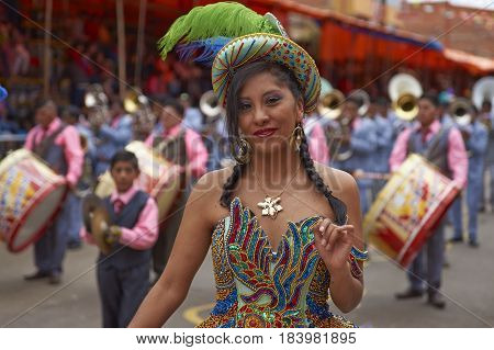 ORURO, BOLIVIA - FEBRUARY 26, 2017: Morenada dance group in colourful outfits parading through the mining city of Oruro on the Altiplano of Bolivia during the annual Oruro Carnival.