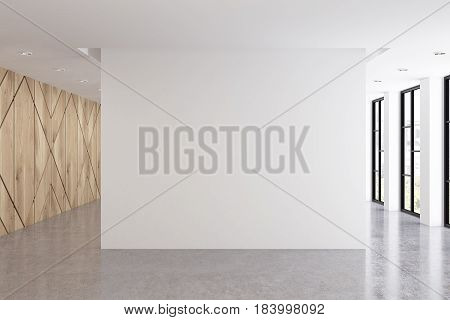 Empty office interior with an x pattern on a light wooden wall. Blank white wall is at the center. Row of tall windows. 3d rendering mock up