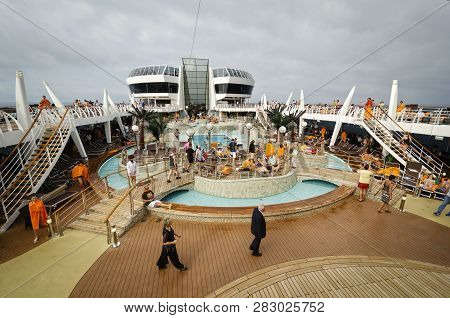 Passenger Ferry, Midsea, Spain - June 09, 2012: Passengers Enjoy At Swimming Pool On Upper Deck Of T