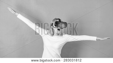 The Woman With Glasses Of Virtual Reality. Confident Young Woman Adjusting Her Virtual Reality Heads