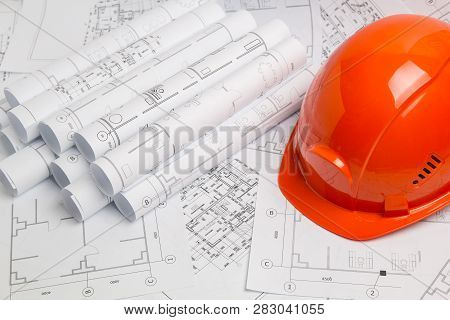 Paper Architectural Drawings, Blueprint And Helmet. Engineering Blueprint