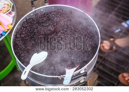 Traditional Thai Black Steamed Sticky Rice In Hot Steamer, Delicious Wholegrain Alternative To White