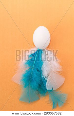 Easter Egg With White Feathers. Colorful Easter Background . Easter Postcard