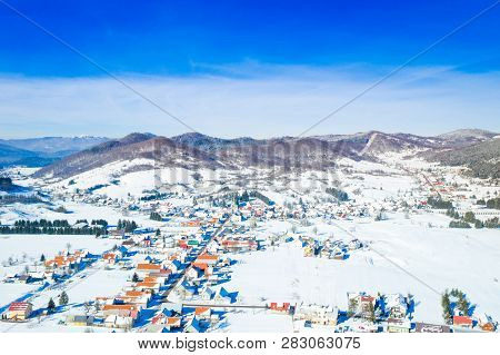 Croatian Countryside Landscape In Winter, Panoramic View Of Small Town Of Mrkopalj Under Snow In Gor