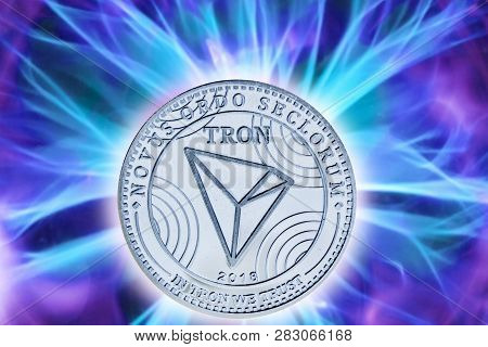 Birth Or Fork Of Tron Cryptocurrency. Coin Background Real Cold Plasma. Trx