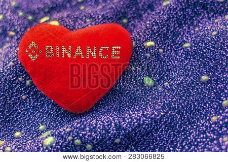 Red Plush Heart With Cryptocurrency Binance On Neon Background. Bnb