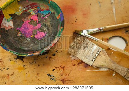 Artist Workstation Paint Mixing Bowl Paint Brushes On A Painters Wood Palete