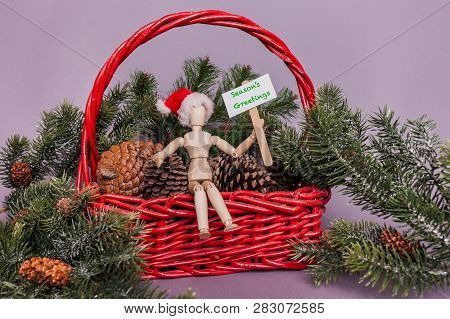 Merry Christmas Happy Holidays Greetings On Picket Sign Held By Wooden Jointed Manikin Doll Sitting 